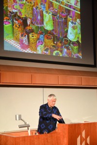 Kaffe Fassett delivers his lecture in front of an image of printed fabric lanterns used to promote his recent exhibition at The American Museum in Bath. 